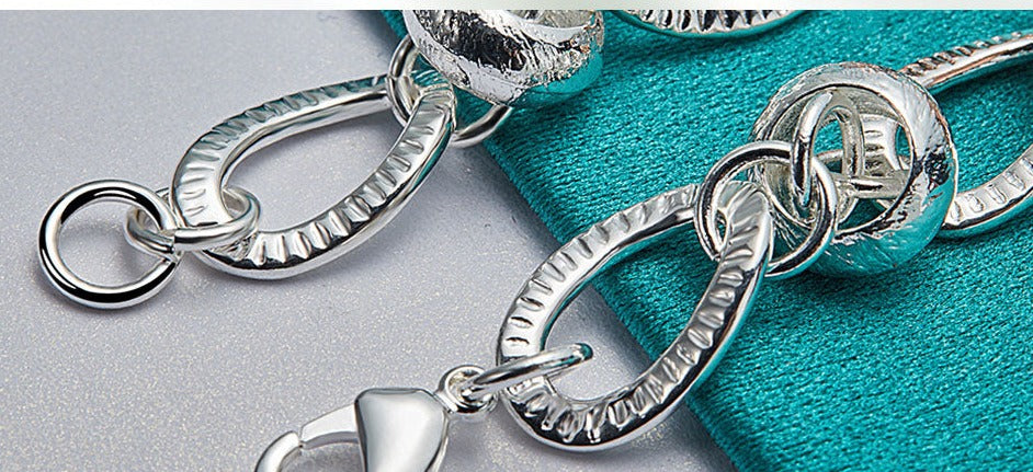 Charming Silver Bracelet with Heart Lock, Clover, and Flower Accents for Women [Low stock]