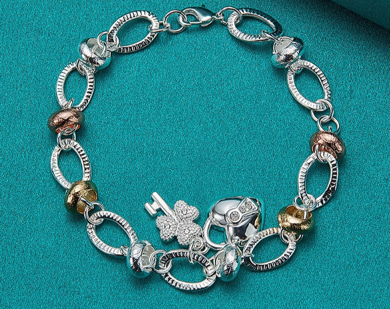 Charming Silver Bracelet with Heart Lock, Clover, and Flower Accents for Women [Low stock]